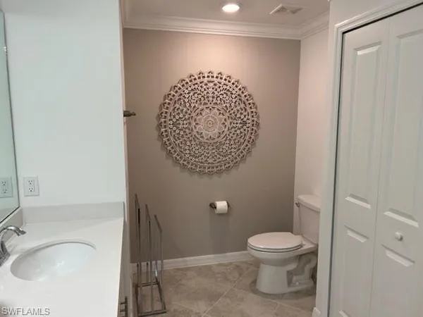 a bathroom with a toilet and a sink