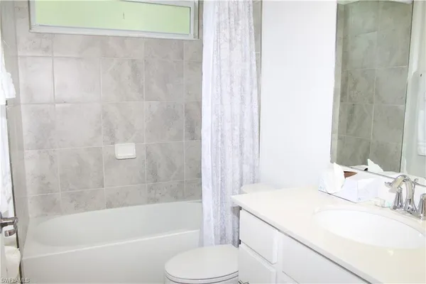 a bathroom with a sink toilet and bathtub