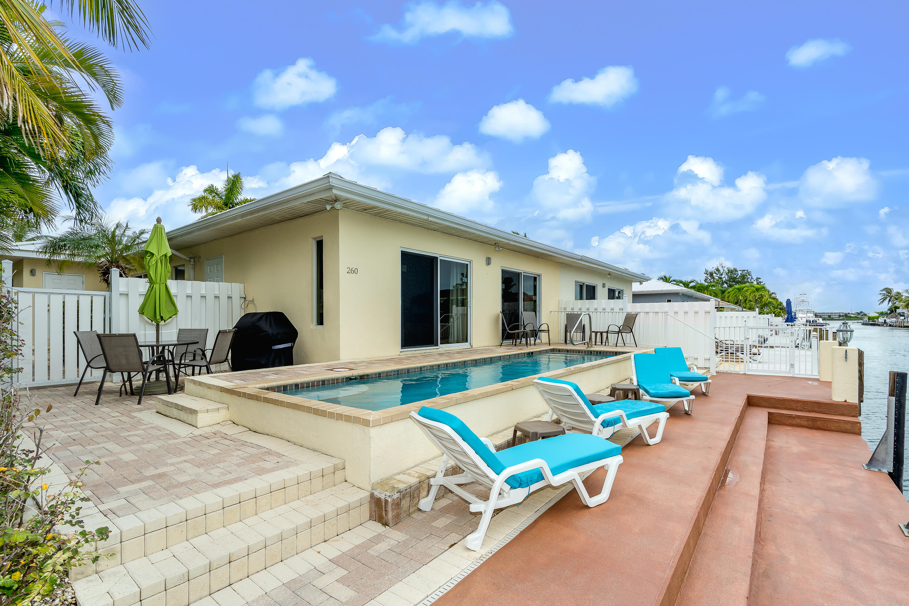 260 Sadowski Causeway Key Colony Beach, FL 33051 - Photo 27 of 50 a view of a patio with a table and chairs