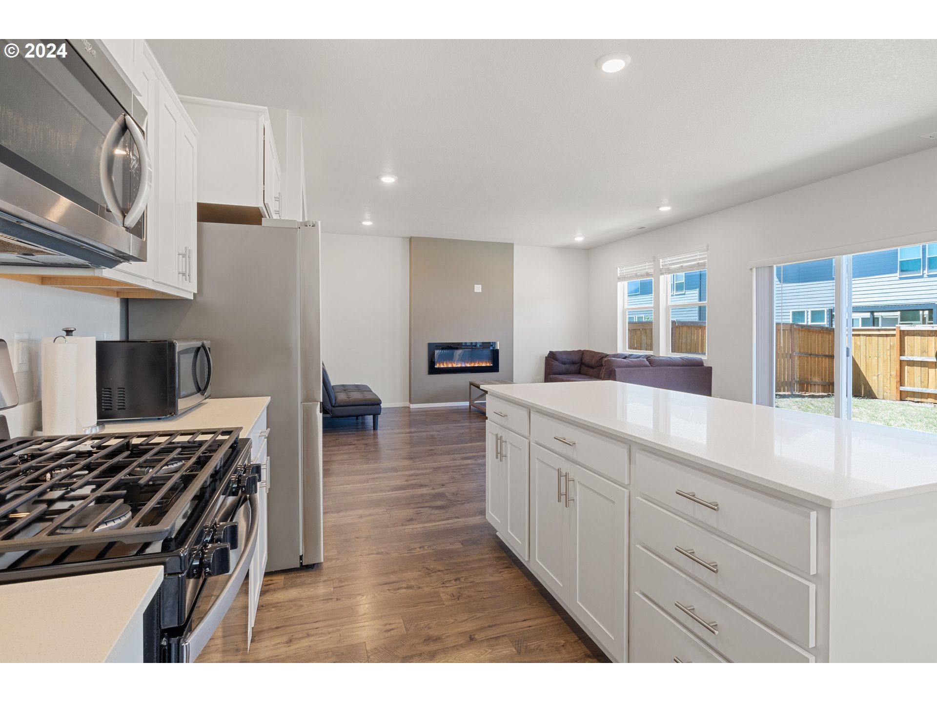 2898 V Street Springfield, OR 97477 - Photo 15 of 47 a kitchen with stainless steel appliances granite countertop a stove and a sink