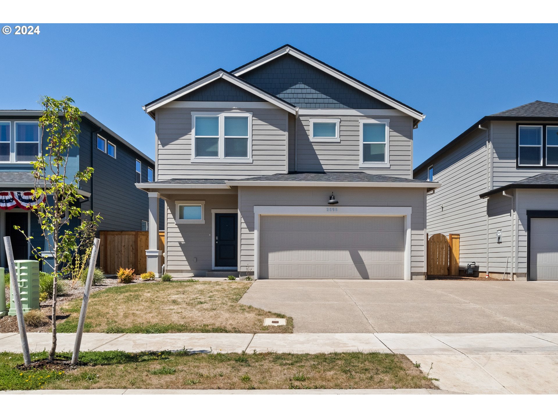 2898 V Street Springfield, OR 97477 - Photo 2 of 47 a view of a house with a yard and garage
