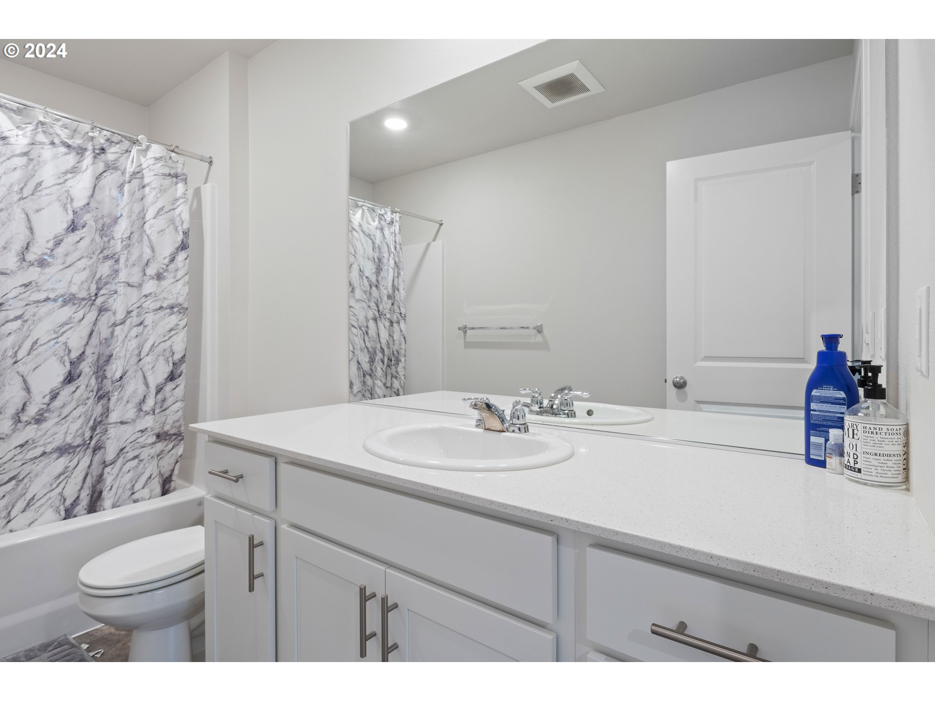 2898 V Street Springfield, OR 97477 - Photo 28 of 47 a bathroom with a sink toilet and a mirror