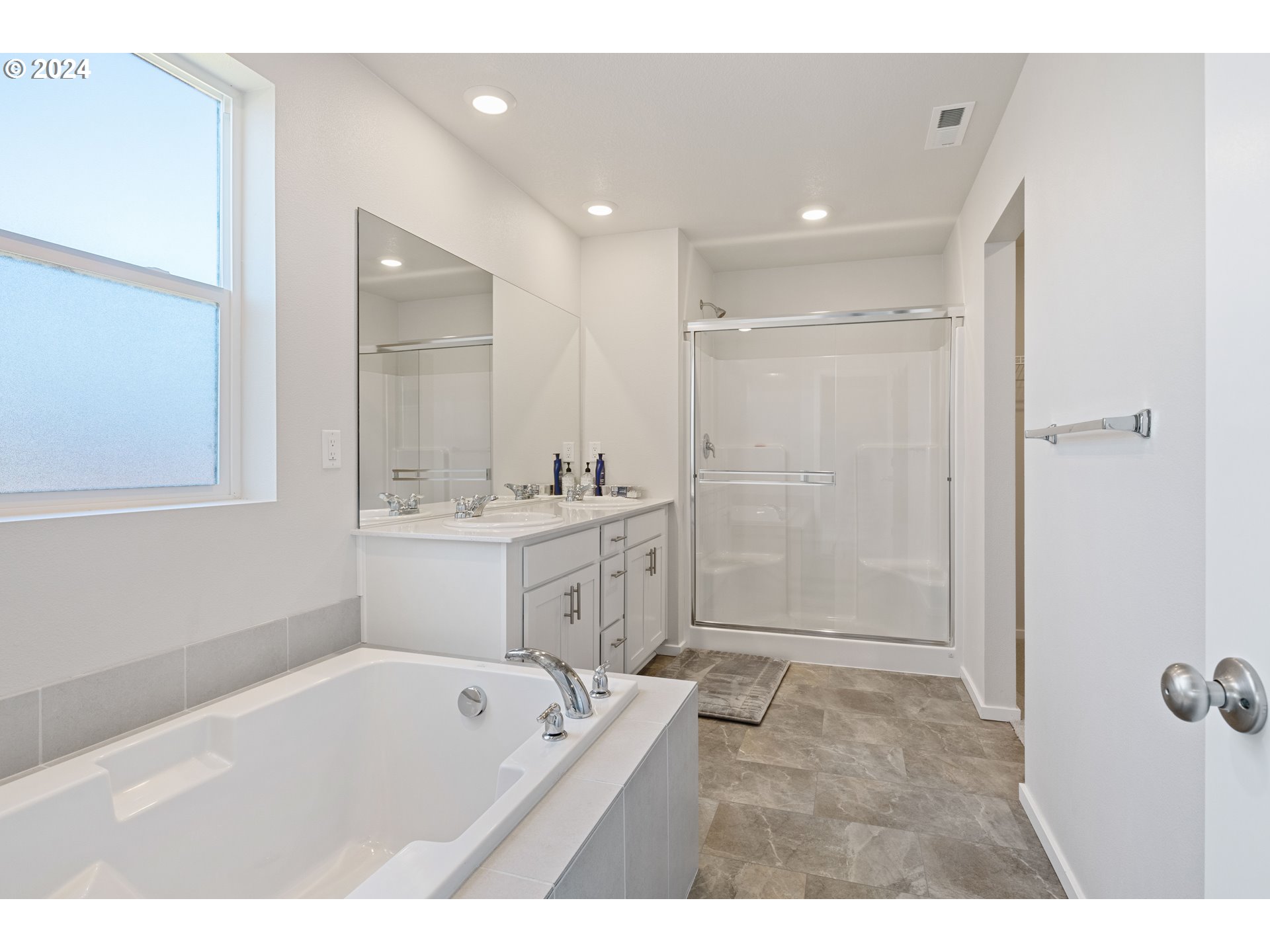 2898 V Street Springfield, OR 97477 - Photo 37 of 47 a bathroom with a tub a sink shower and mirror