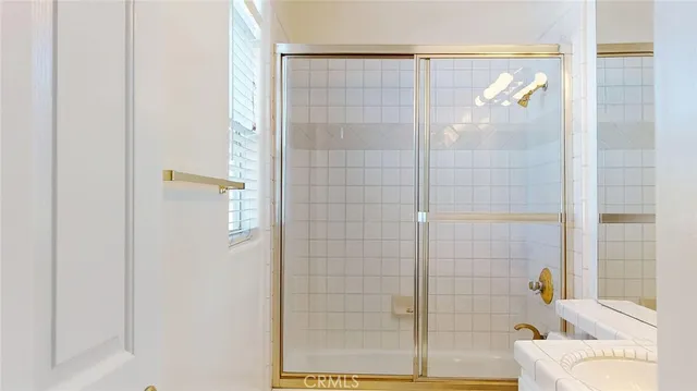 a bathroom with a bathtub and shower
