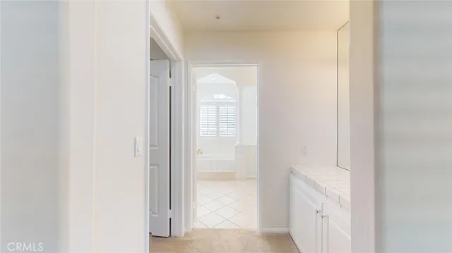 a view of a bathroom from a hallway