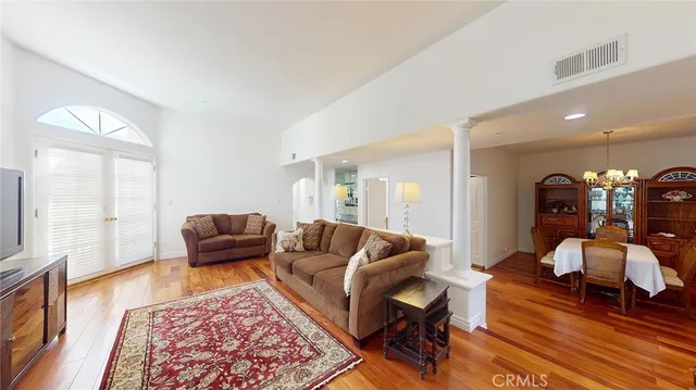a living room with furniture and a rug