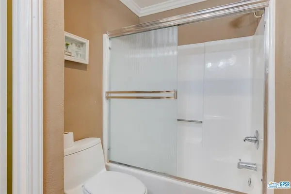 a en suite bathroom with a sink and a mirror