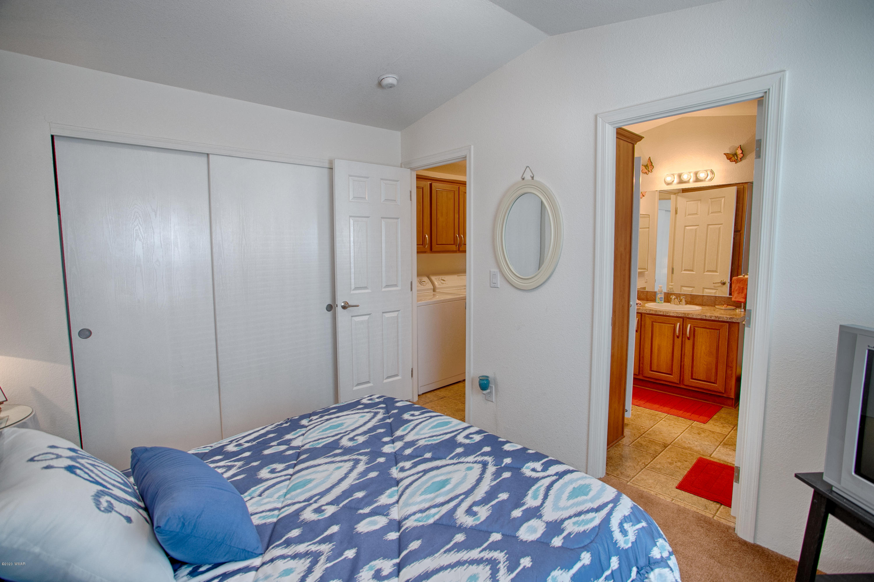 4192 West Blue Ridge Loop Pinetop, AZ 85935 - Photo 13 of 14 a bedroom with a bed and a closet