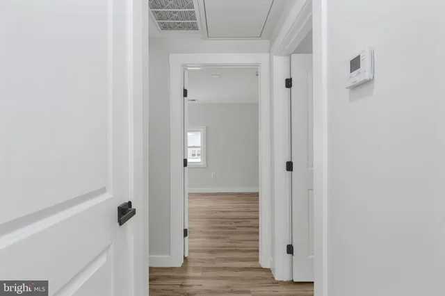 a view of a bathroom with wooden floor