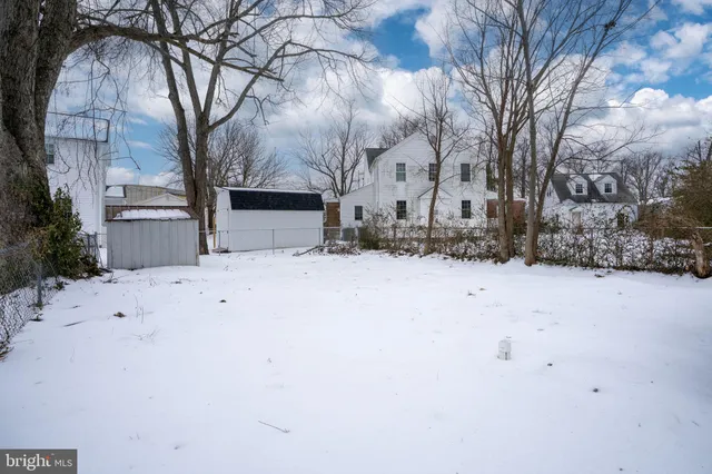 a view of snow on the side of the road