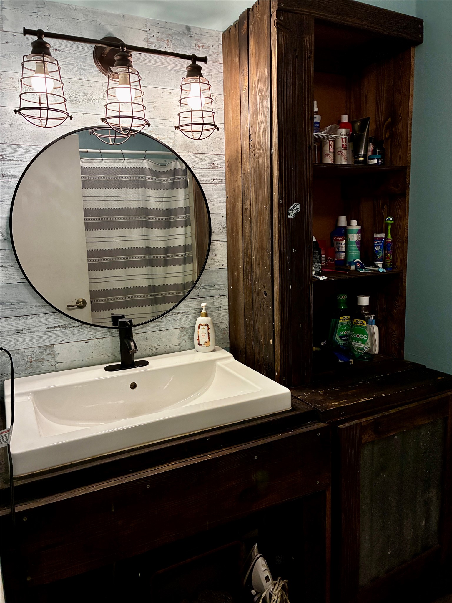2 Sarita Road Angleton, TX 77515 - Photo 13 of 21 a bathroom with a sink and a mirror