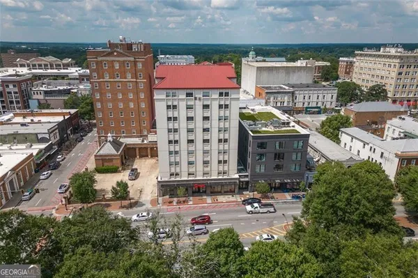 an aerial view of a building with outdoor space