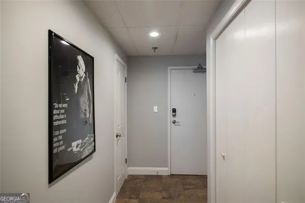 a view of hallway with walk in closet