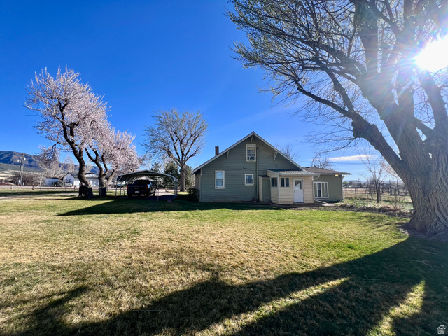 479 East 100 N Road Meadow, UT 84644 - Photo 41 of 59 View of side of property with a detached carport