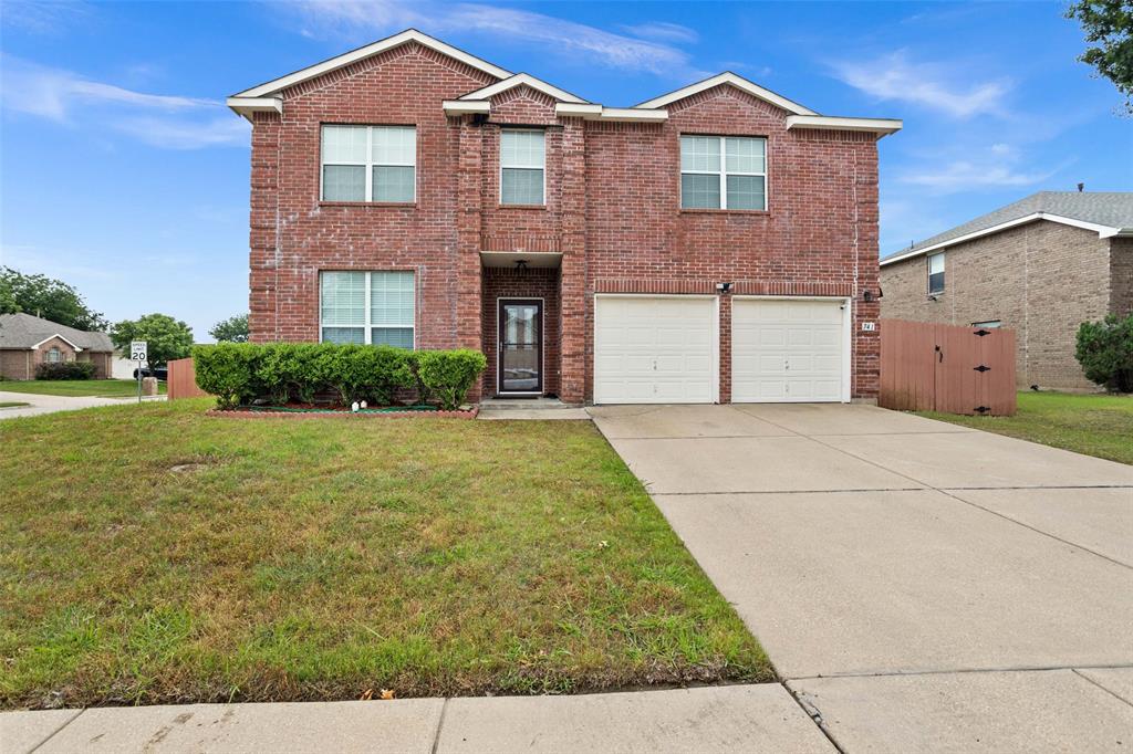 741 Pheasant Road Saginaw, TX 76131 - Photo 1 of 1 a front view of a house with yard