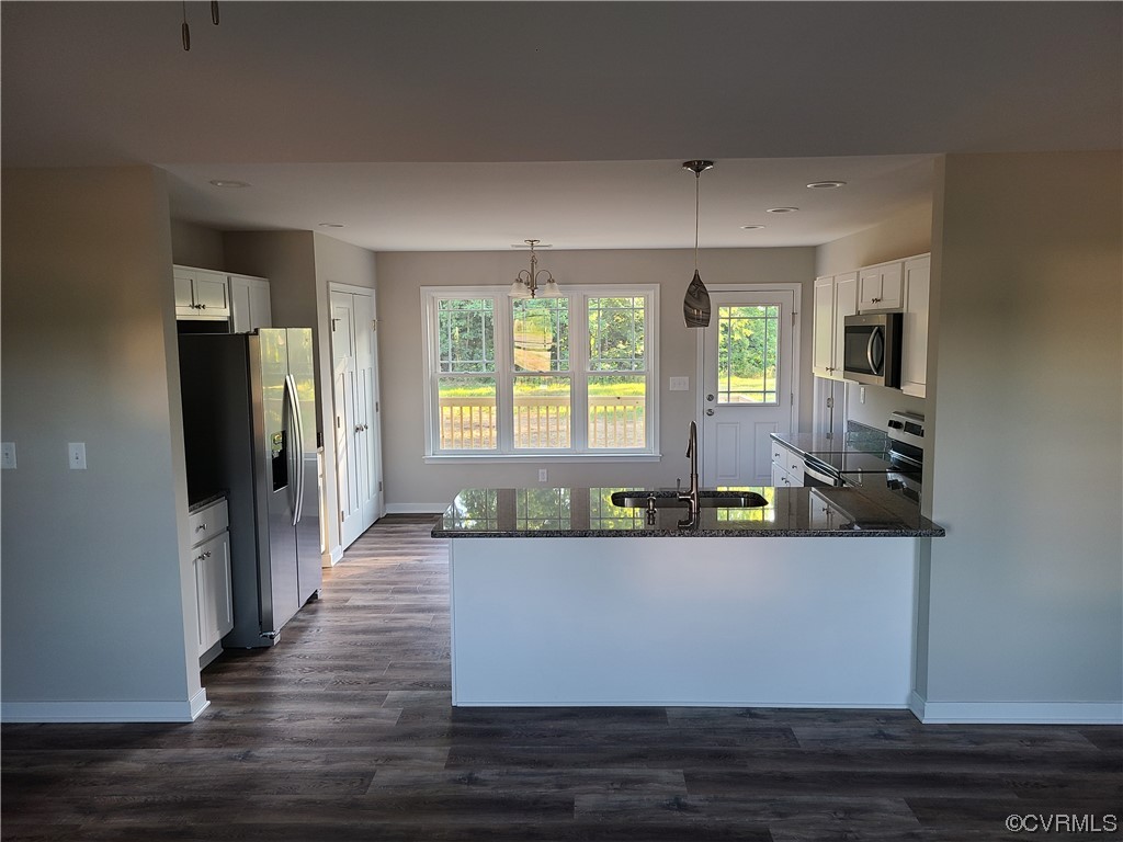 319 Hawkins Farm Road Bumpass, VA 23024 - Photo 4 of 11 a view of a living room a window and a flat screen tv