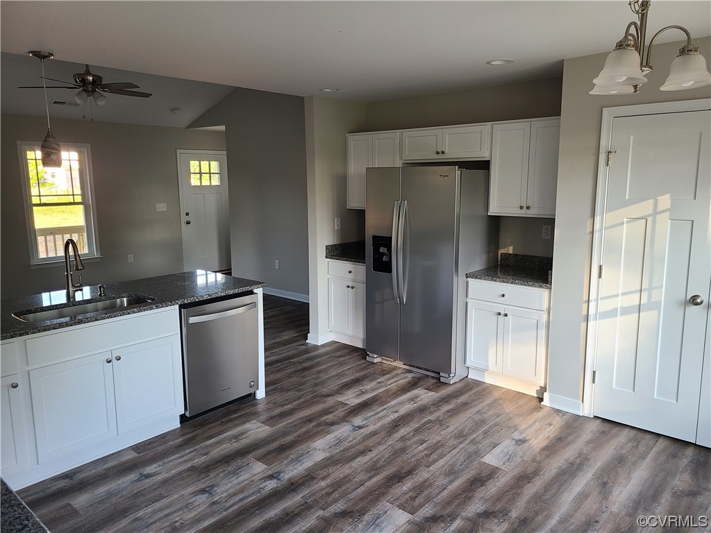 319 Hawkins Farm Road Bumpass, VA 23024 - Photo 5 of 11 a kitchen with stainless steel appliances a refrigerator sink and cabinets