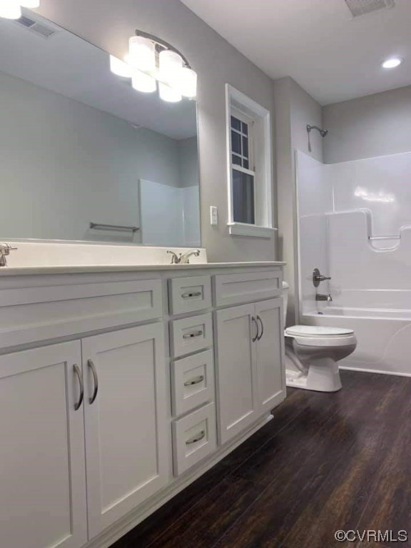 319 Hawkins Farm Road Bumpass, VA 23024 - Photo 7 of 11 a bathroom with a double vanity sink a toilet and a mirror
