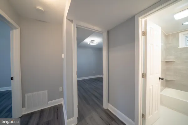 a view of a bathroom from a hallway