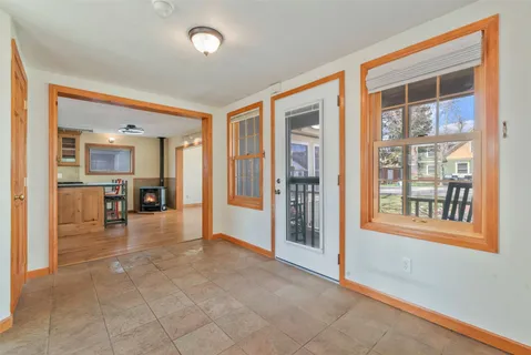 a kitchen with granite countertop wooden floors and wide window