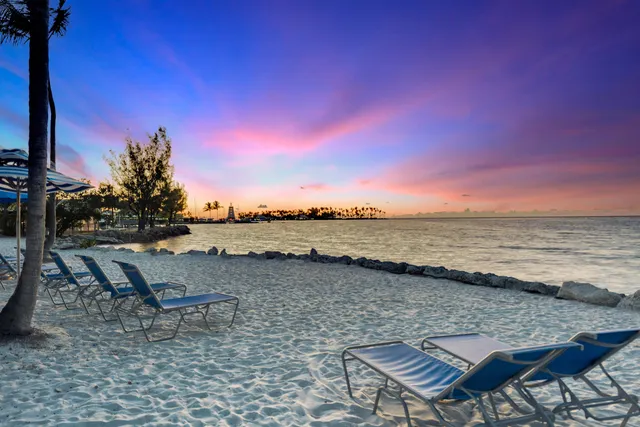 a view of swimming pool with outdoor seating and lake