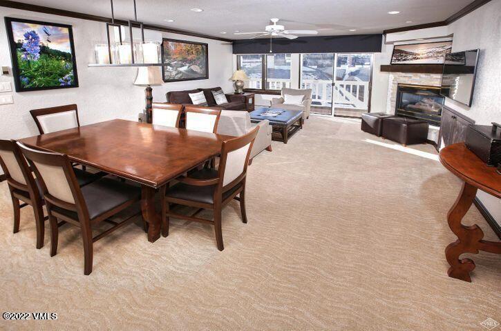210 Offerson Road, Unit 21029 Beaver Creek, CO 81620 - Photo 3 of 16 a view of a dining room with furniture window and outside view