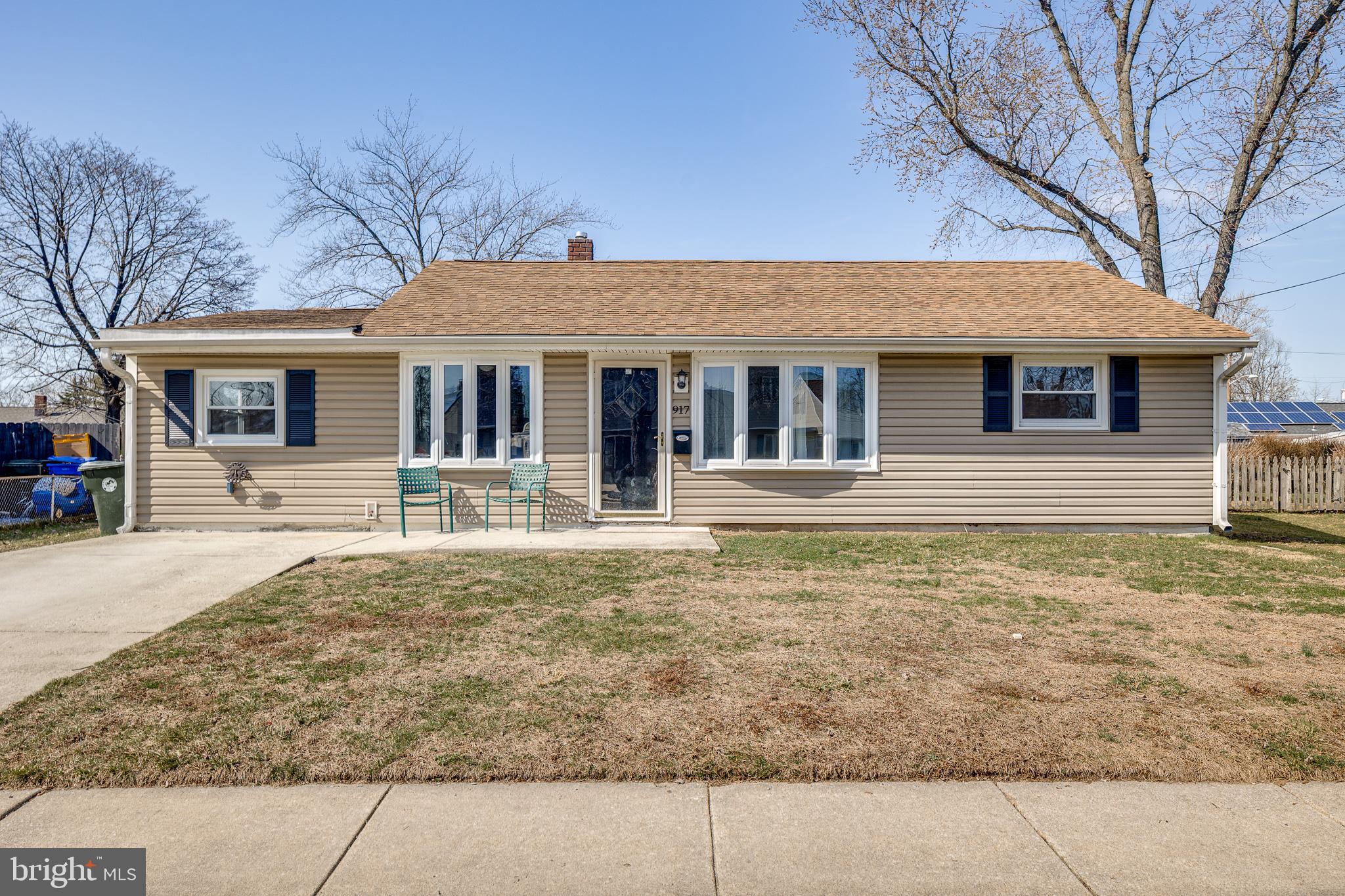 a house that has a tree in front of it