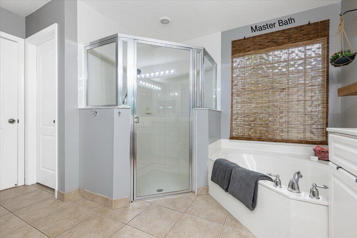 2484 Southwest Century Way Stuart, FL 34997 - Photo 31 of 56 Master Bath large shower & Roman Tub