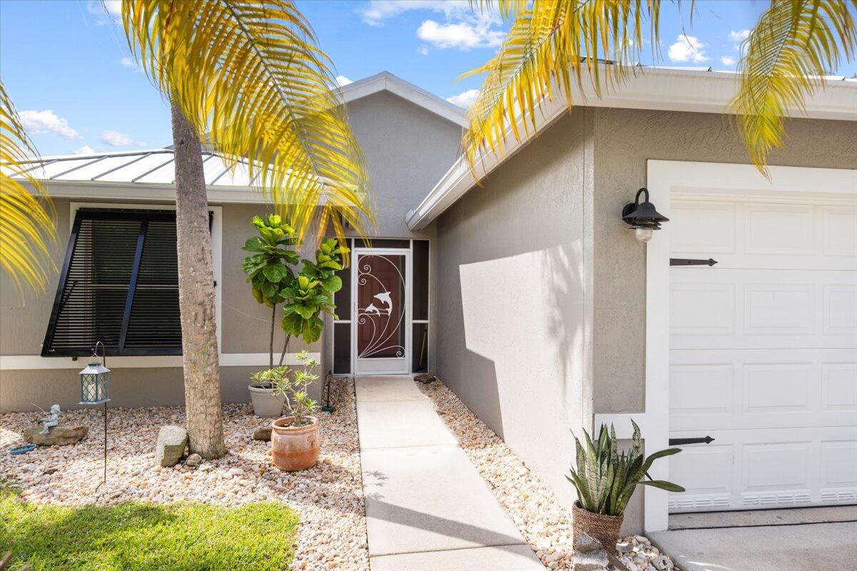 2484 Southwest Century Way Stuart, FL 34997 - Photo 3 of 56 Front entry screen enclosed
