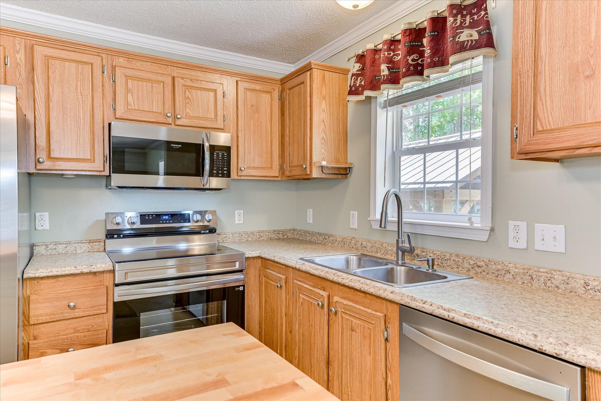 1405 Garrett Road Clarks Hill, SC 29821 - Photo 18 of 51 a kitchen with a sink stove and microwave
