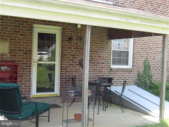 524 Paddock Road Havertown, PA 19083 - Photo 5 of 15 a front view of a house with a chairs and table in a patio
