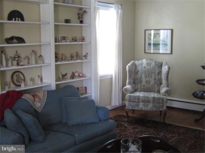 524 Paddock Road Havertown, PA 19083 - Photo 7 of 15 a living room with furniture and a book shelf