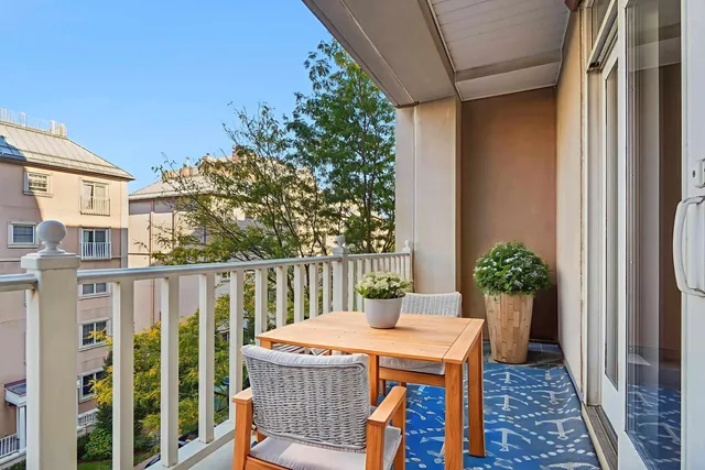 a view of a balcony with furniture