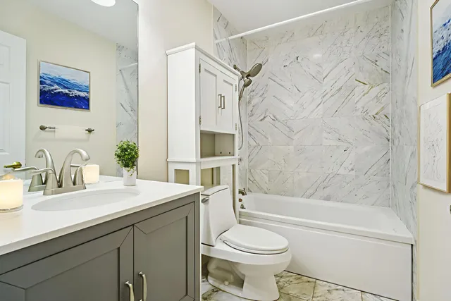 a bathroom with a sink a toilet and a bathtub