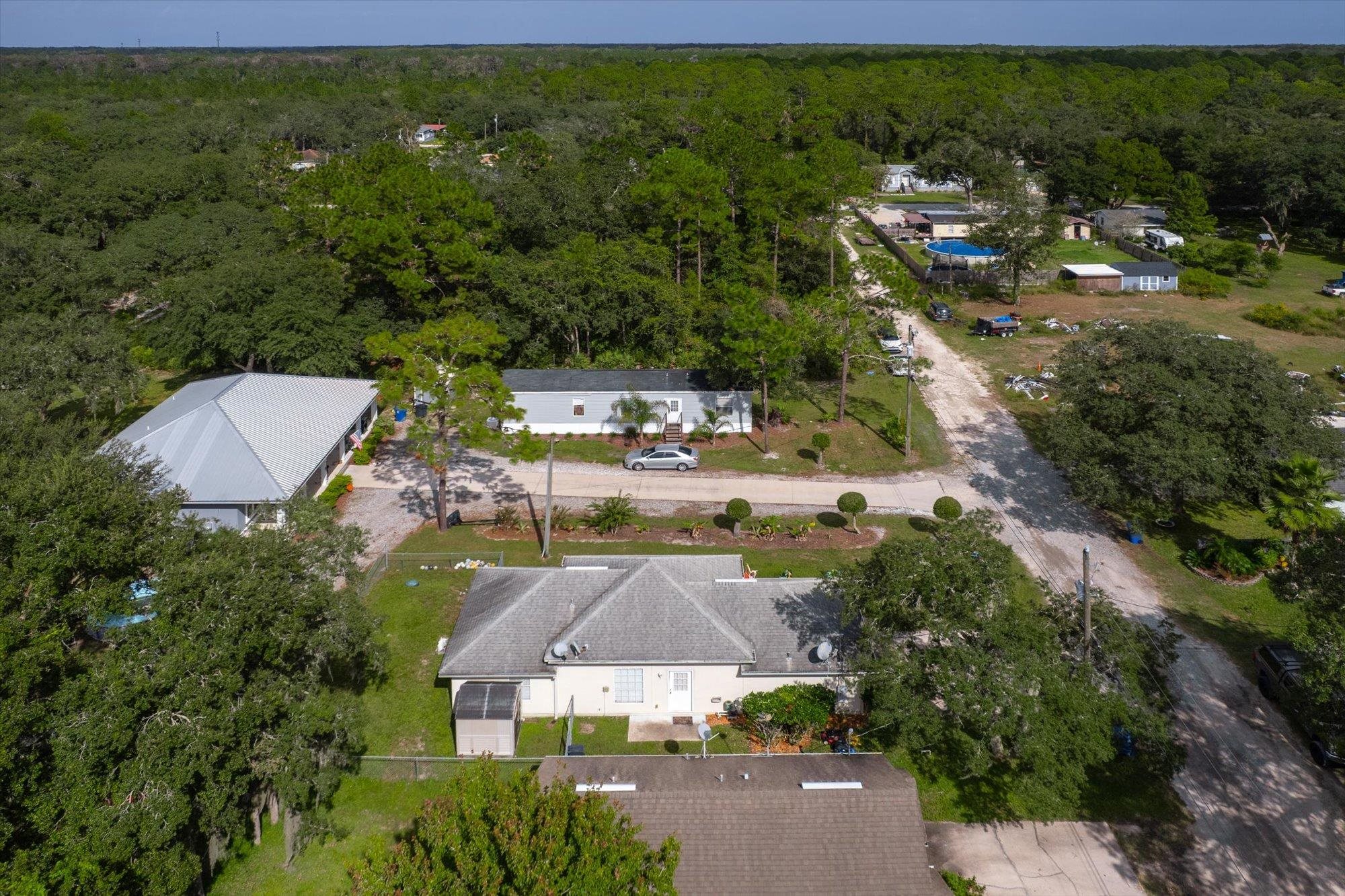 3372 4th Street Elkton, FL 32033 - Photo 33 of 36 an aerial view of residential houses with outdoor space and street view