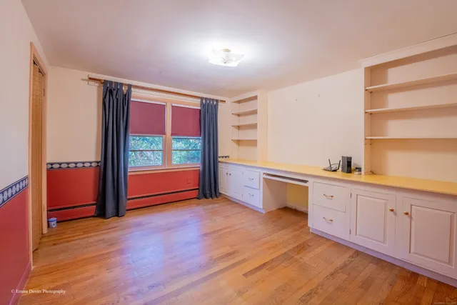 a view of cabinets and wooden floor
