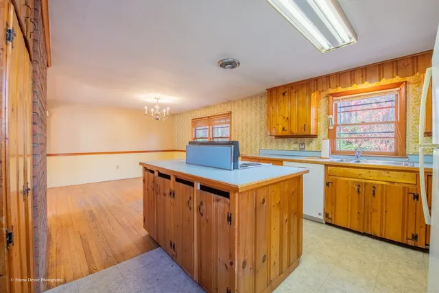 a kitchen with stainless steel appliances granite countertop a sink and a cabinets