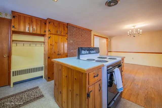 a kitchen with stainless steel appliances a sink and a large window