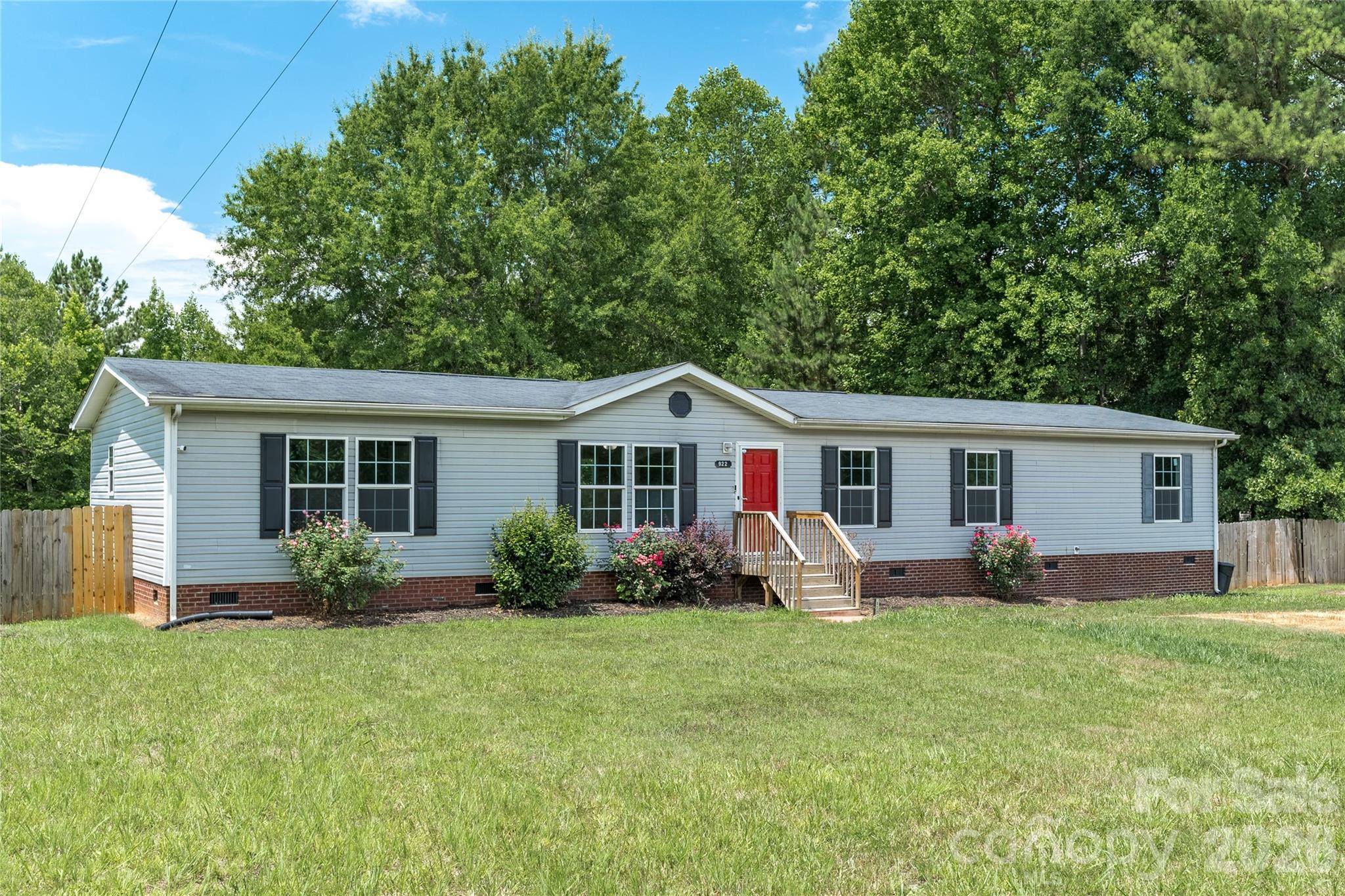 922 Lavender Road Grover, NC 28073 - Photo 3 of 43 a front view of house with yard and outdoor seating