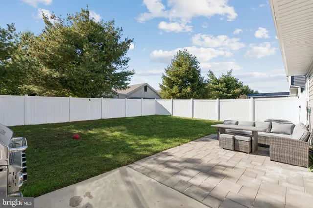 a view of a backyard with furniture