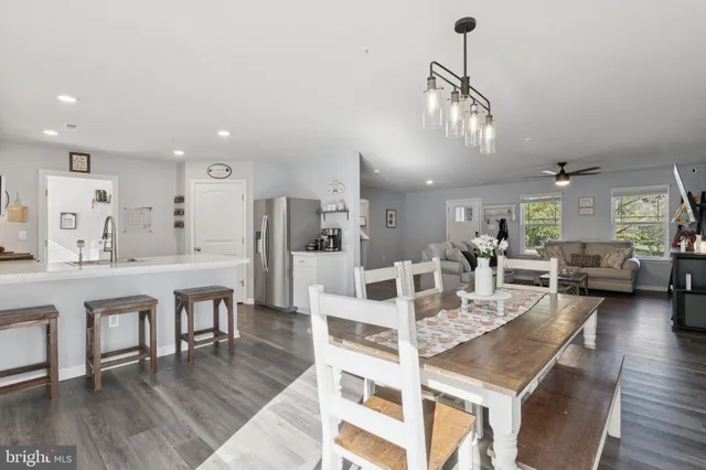 a large kitchen with a table and chairs