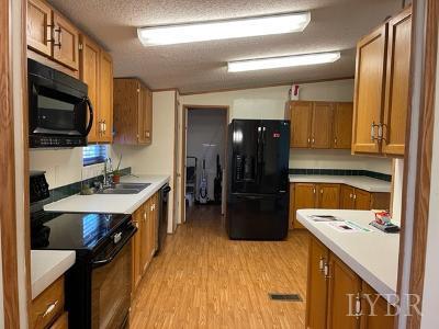 514 West Lake Road Spout Spring, VA 24593 - Photo 8 of 19 a kitchen with a sink stove and refrigerator