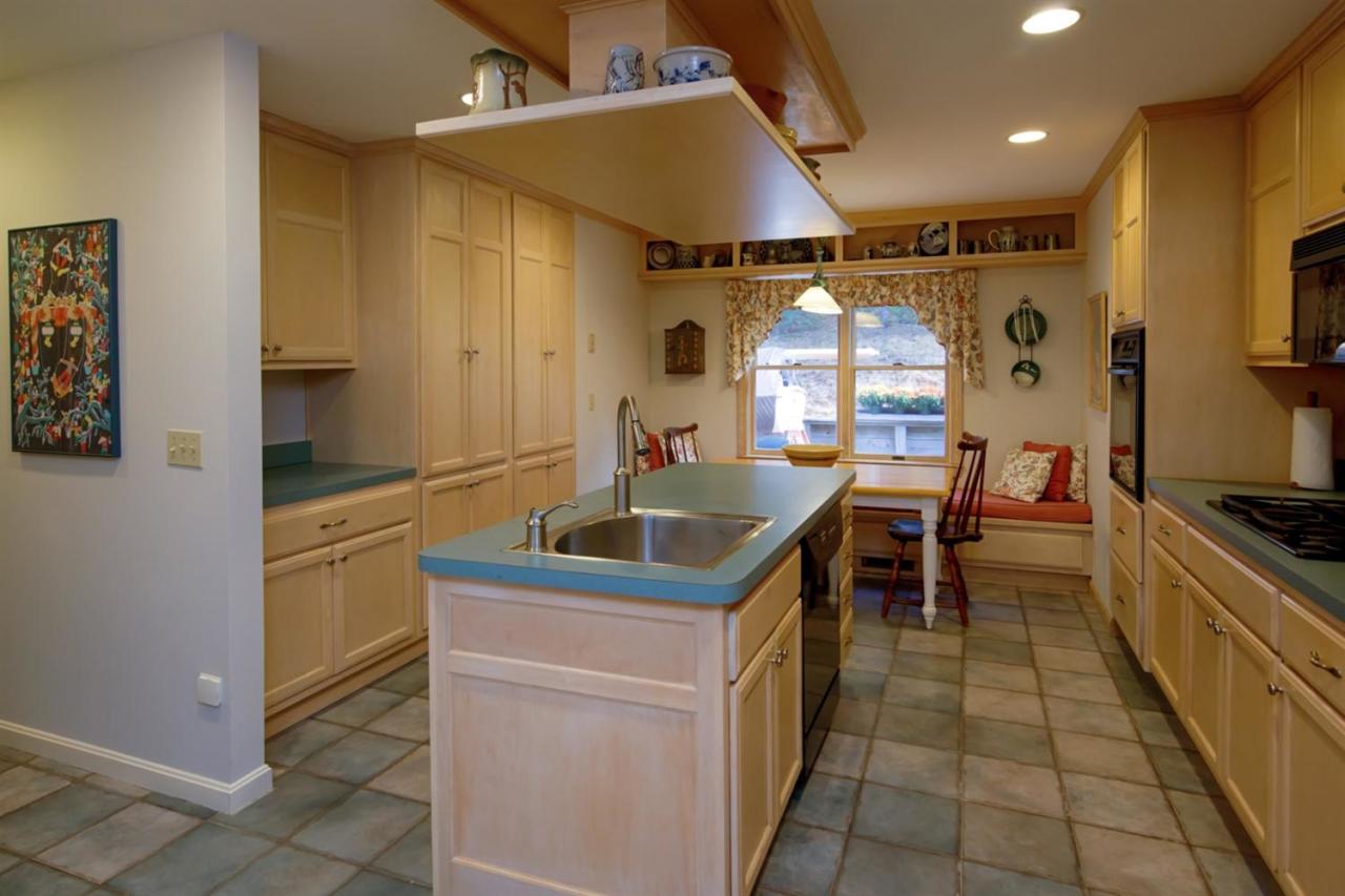 188 Abbey Gate Road Cotuit, MA 02635 - Photo 11 of 23 a kitchen with stainless steel appliances granite countertop a sink and a refrigerator
