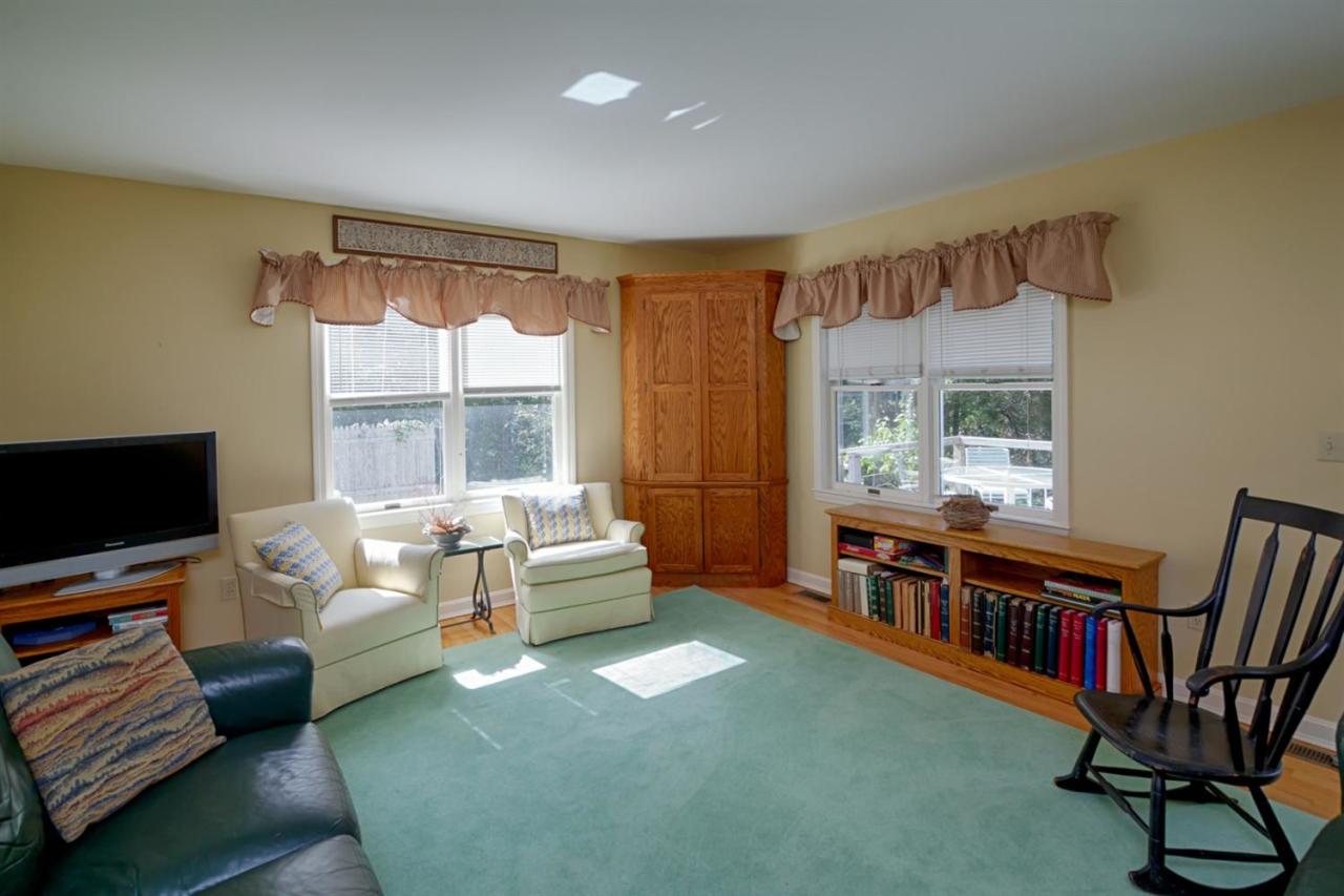 188 Abbey Gate Road Cotuit, MA 02635 - Photo 12 of 23 a living room with furniture and a flat screen tv