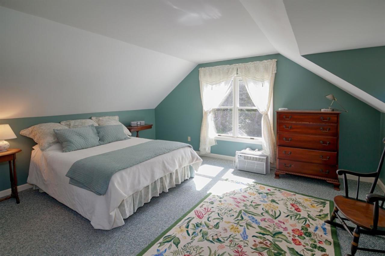 188 Abbey Gate Road Cotuit, MA 02635 - Photo 13 of 23 a bedroom with a bed and a window