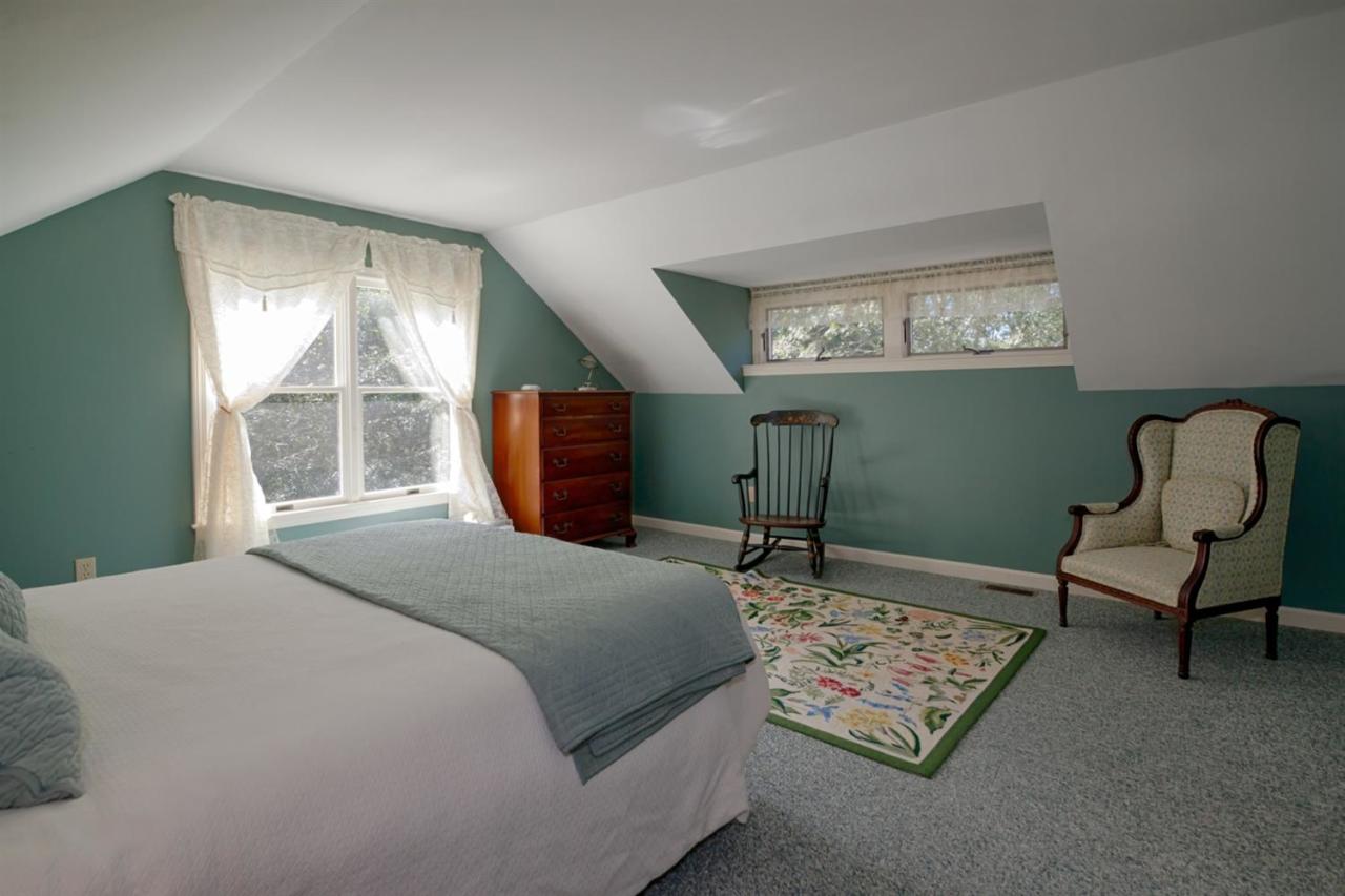 188 Abbey Gate Road Cotuit, MA 02635 - Photo 14 of 23 a bedroom with a bed chair and window