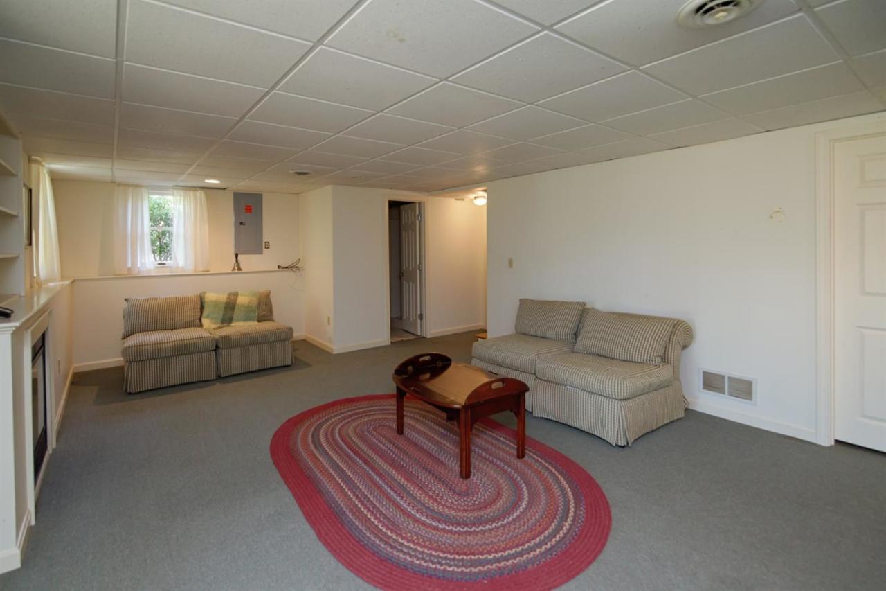188 Abbey Gate Road Cotuit, MA 02635 - Photo 16 of 23 a living room with furniture and a gym