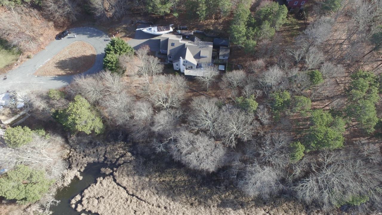 188 Abbey Gate Road Cotuit, MA 02635 - Photo 22 of 23 a view of a backyard