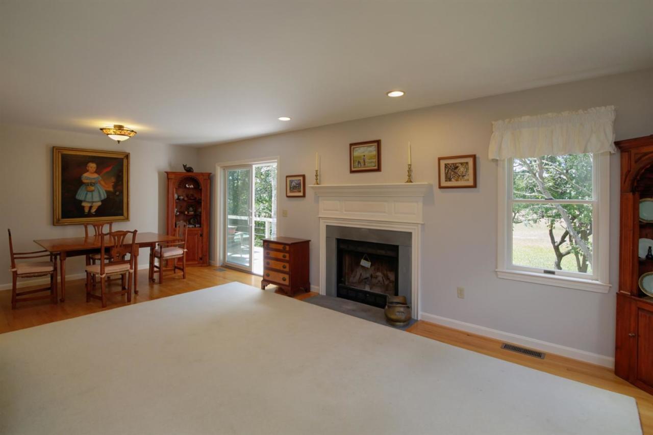 188 Abbey Gate Road Cotuit, MA 02635 - Photo 4 of 23 a view of livingroom with furniture fireplace and window