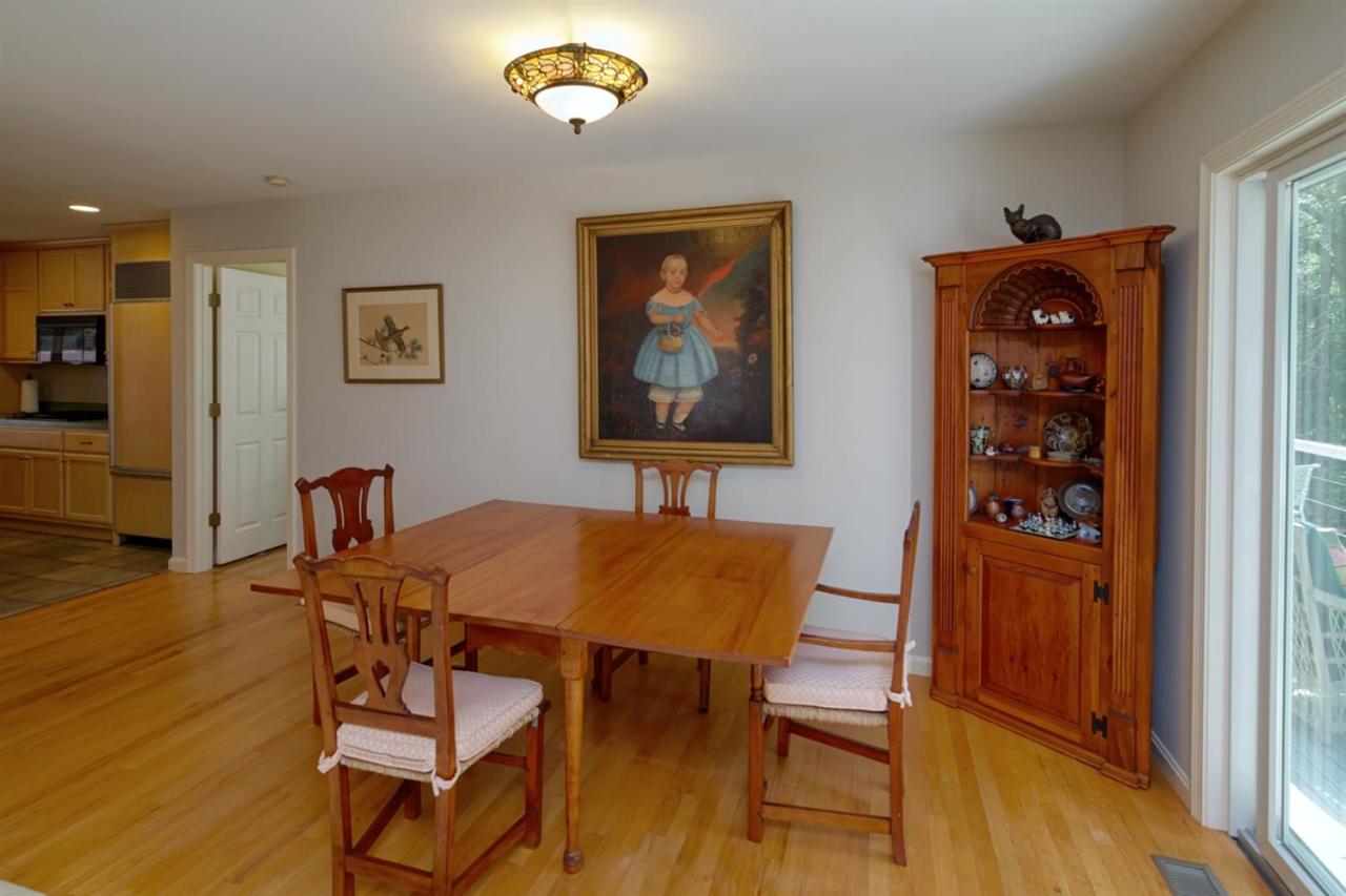 188 Abbey Gate Road Cotuit, MA 02635 - Photo 7 of 23 a view of a dining room with furniture and wooden floor